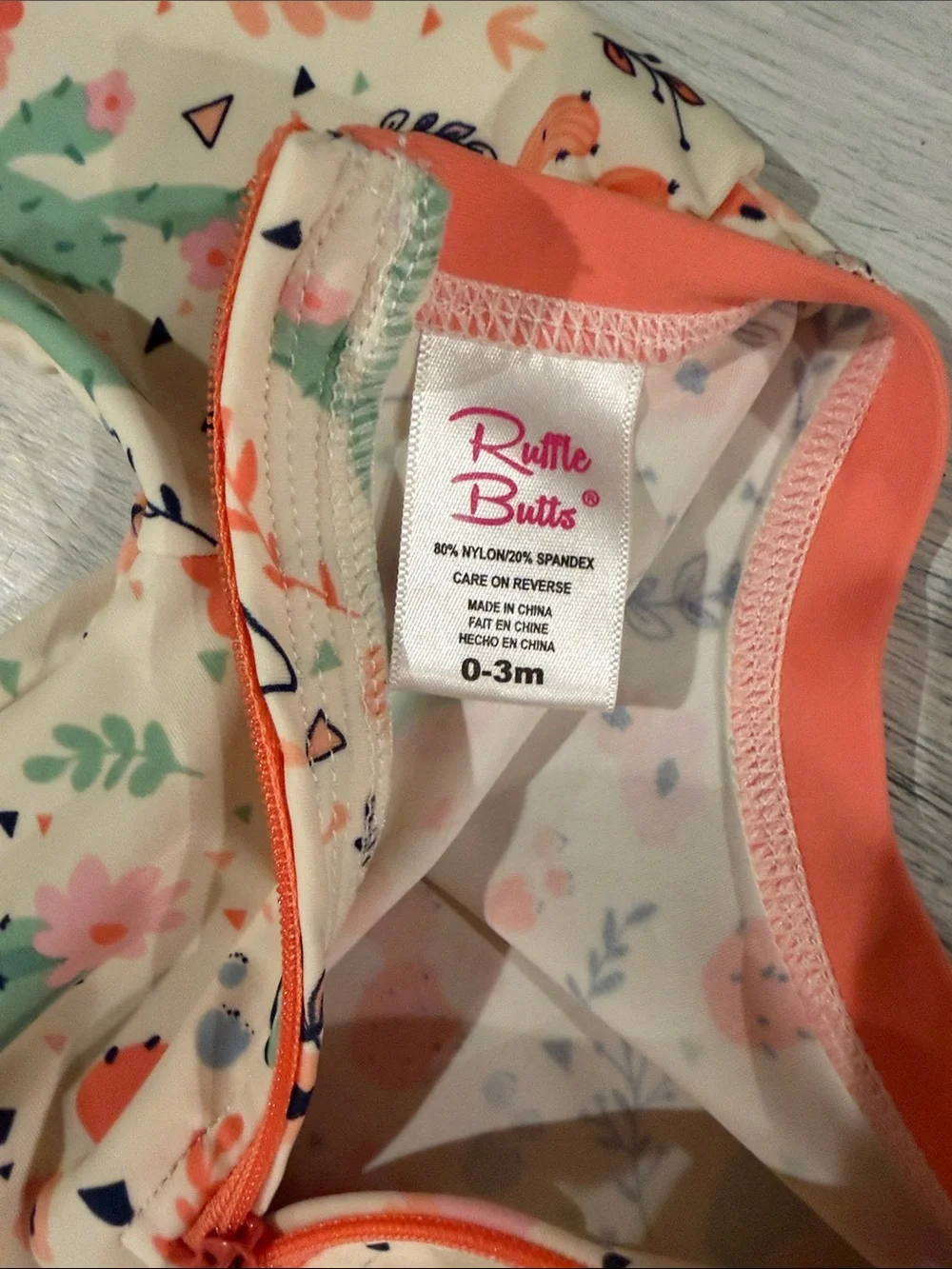 Ruffle Butts Cream Cactus-Print Long-Sleeve One-Piece with Coral Trim size 0-3mo